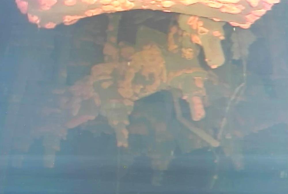 This image captured by an underwater robot provided by International Research Institute for Nuclear Decommissioning shows a part of a control rod drive of Unit 3 at Fukushima Dai-ichi nuclear plant in Okuma town, northeastern Japan Wednesday, July 19, 2017. The underwater robot has captured images and other data inside Japan's crippled nuclear plant on its first day of work. The robot is on a mission to study damage and find fuel that experts say has melted and mostly fallen to the bottom of a chamber and has been submerged by highly radioactive water. (International Research Institute for Nuclear Decommissioning via AP)